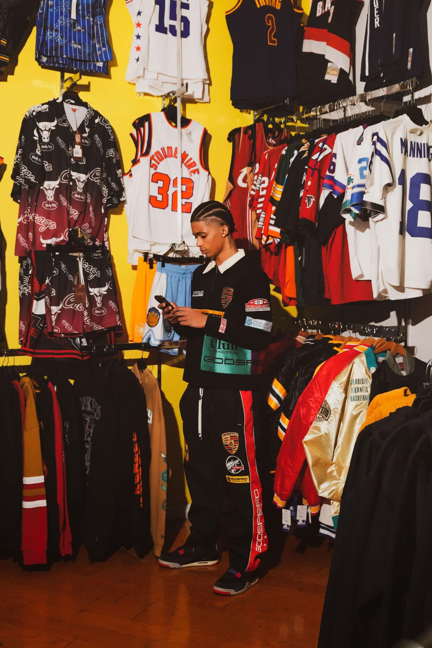 Browsing a sports jersey store lined with vintage jerseys
